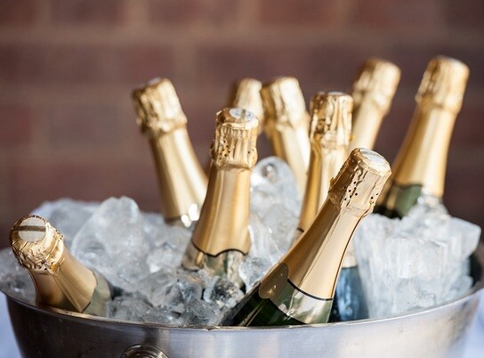 champagne-bottles-in-ice-bucket champagne-bottles-in-ice-bucket
